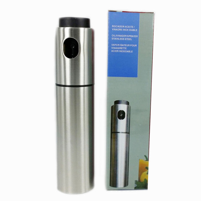 The Mr. Mister Point And Spray Olive Oil Spritzer by VistaShops, an essential healthy cooking tool, sits beside its packaging box displaying product information in multiple languages.
