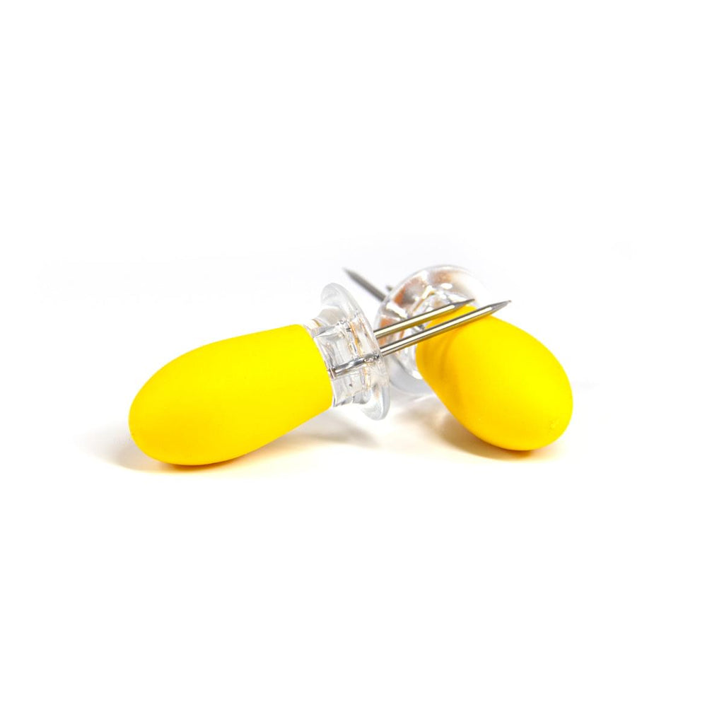 A pair of Grand Fusion Housewares, LLC Corn on the Cob Holders with Stainless Steel Prongs & Silicone Grips on a white surface perfect for foodies.