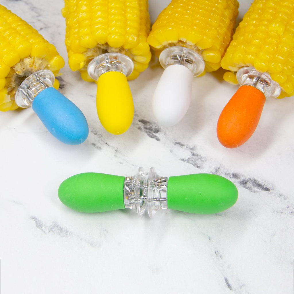 A group of colorful Grand Fusion Housewares, LLC Corn on the Cob Holders with Stainless Steel Prongs & Silicone Grips perfect for foodies.