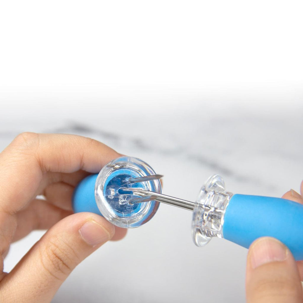 A person is holding a Corn on the Cob Holders with Stainless Steel Prongs & Silicone Grips by Grand Fusion Housewares, LLC from the XSpecial Marketplace.