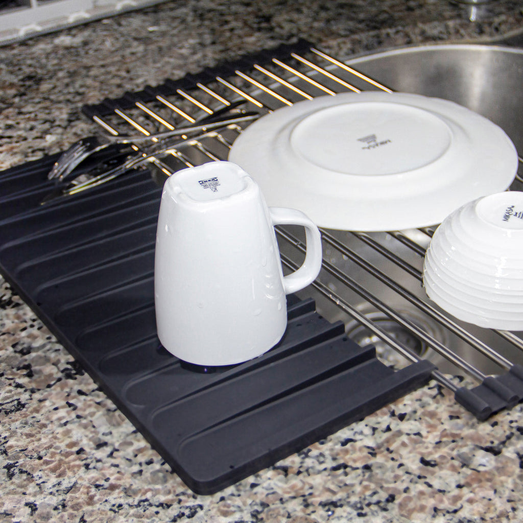 An Over Sink Roll-Up Dish Drying Rack with Silicone Drip Tray by Grand Fusion Housewares, LLC on a counter top at XSpecial Marketplace.