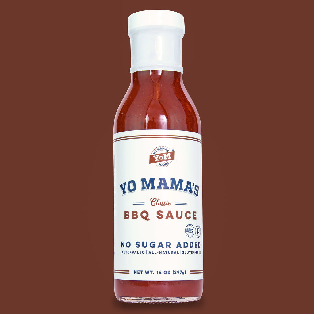 A bottle of Classic BBQ sauce from Yo Mama's Foods on a brown background, displayed alongside the XSpecial Marketplace.