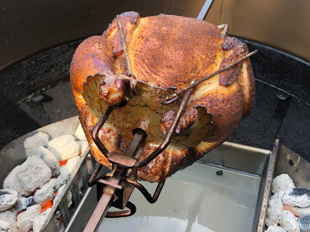 A Blade Meat Tenderizer Tool for Foodies, Featured on Shark Tank by Grand Fusion Housewares, LLC is being cooked in an outdoor grill.