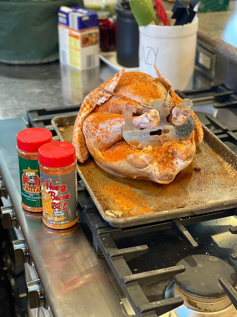A Turbo Trusser for Chicken or Turkey, Featured on Shark Tank by Grand Fusion Housewares, LLC, designed to easily truss poultry on a baking sheet using XSpecial Marketplace's Blade