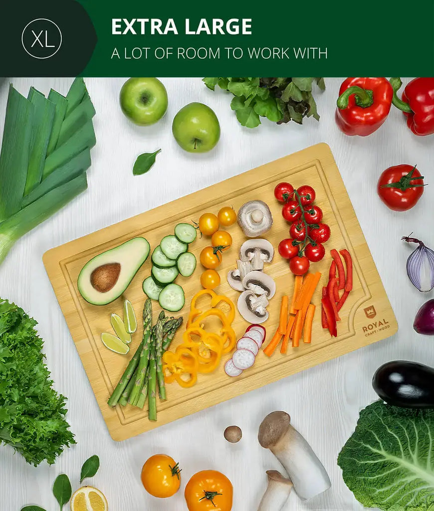 A XSpecial bamboo cutting board 12x18 by Royal Craft Wood with vegetables and fruits on it.