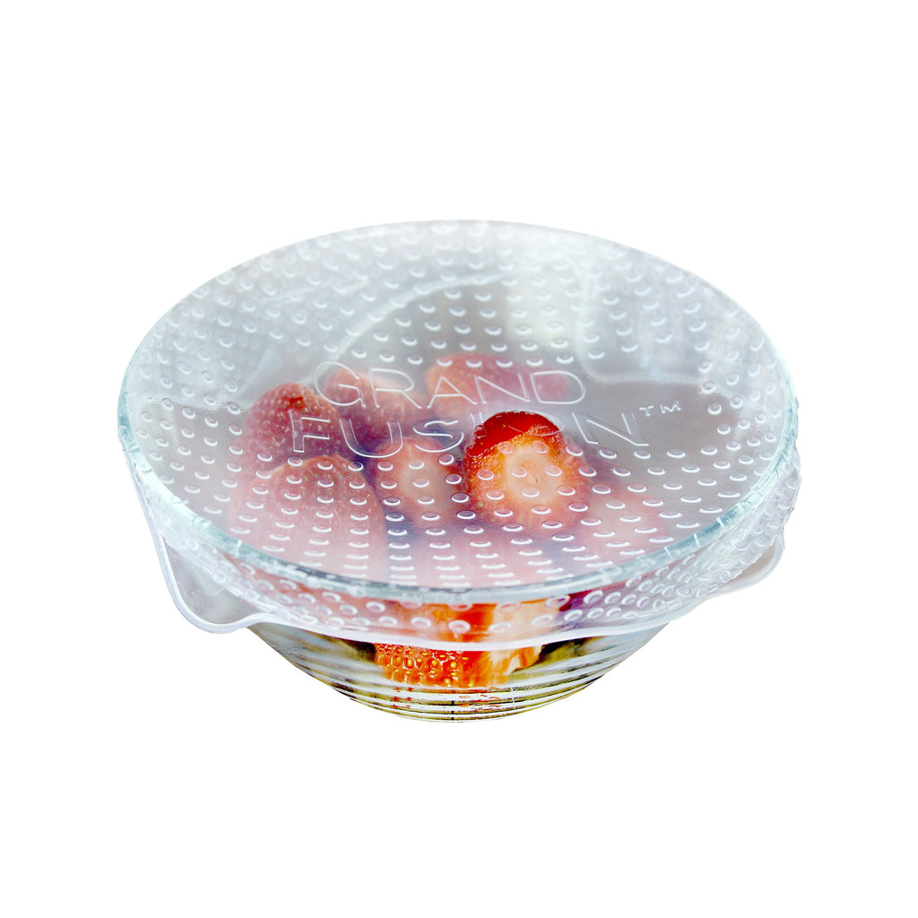A Silicone Food Wrap 4 Pack with strawberries in it from Grand Fusion Housewares, LLC, perfect for glass, ceramic, and metal containers.