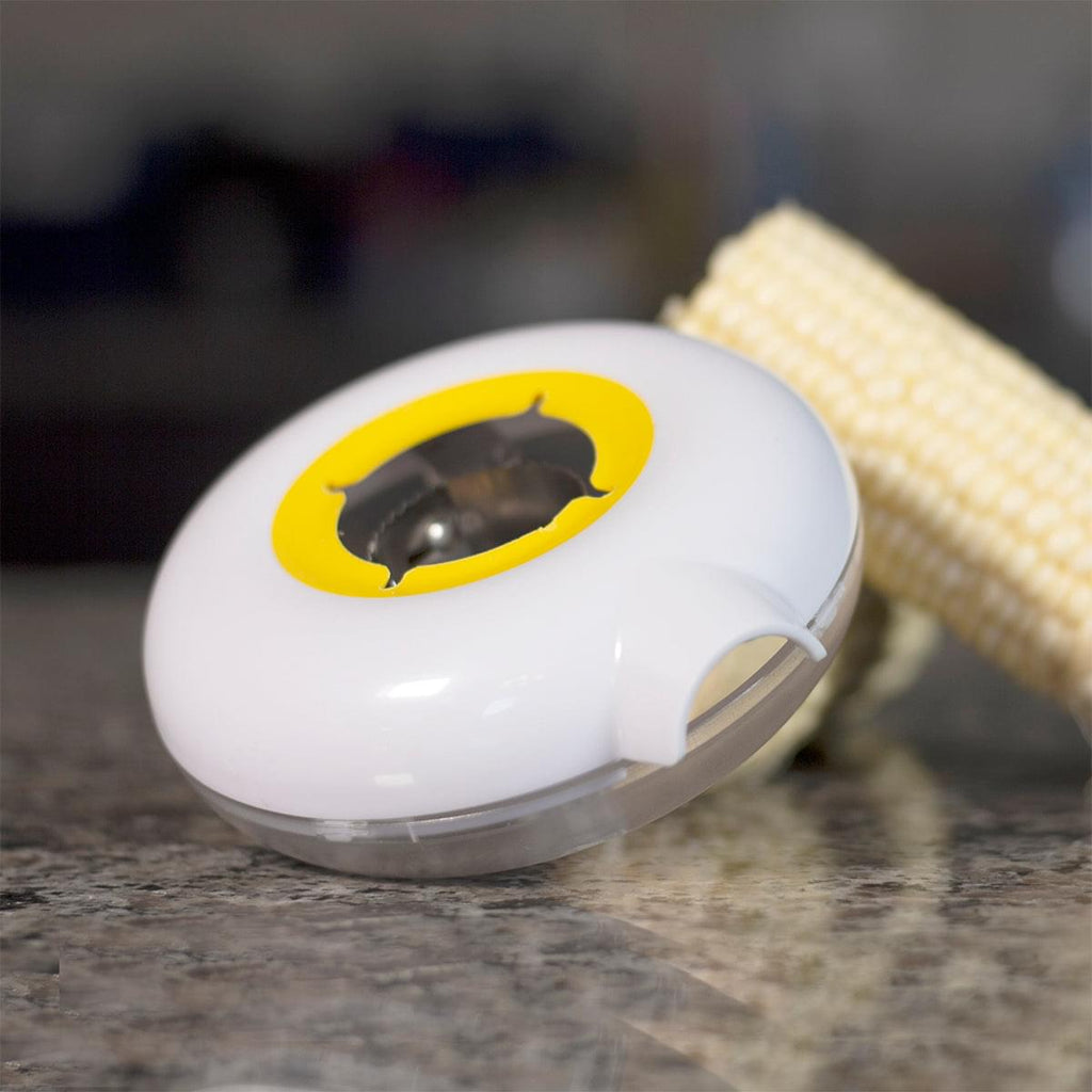 A Grand Fusion Housewares, LLC Corn Peeler with Circular Stainless Steel Blade beautifully strips corn cob, while a plastic container catches kernels for foodies.