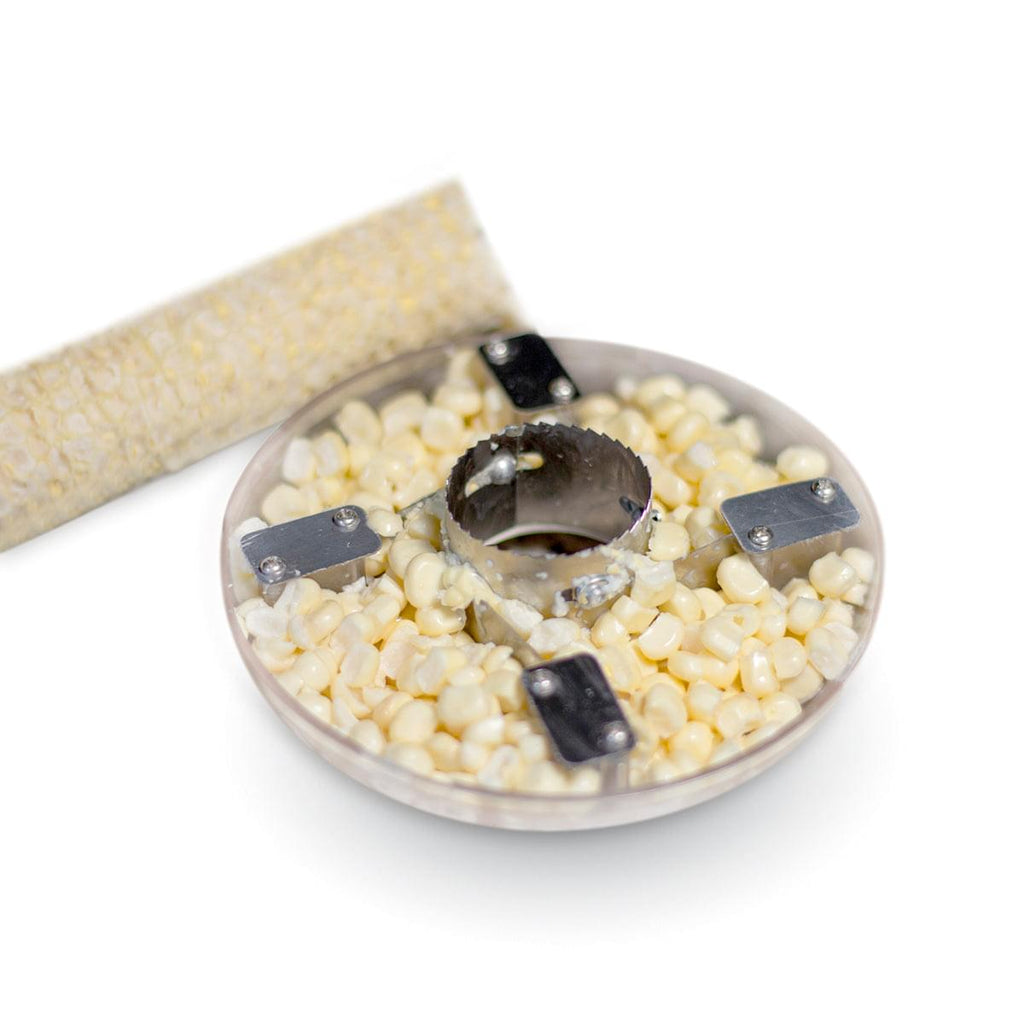 A bowl of corn with a Grand Fusion Housewares, LLC Corn Peeler cleanly strips corn cob - Plastic Container catches kernel.