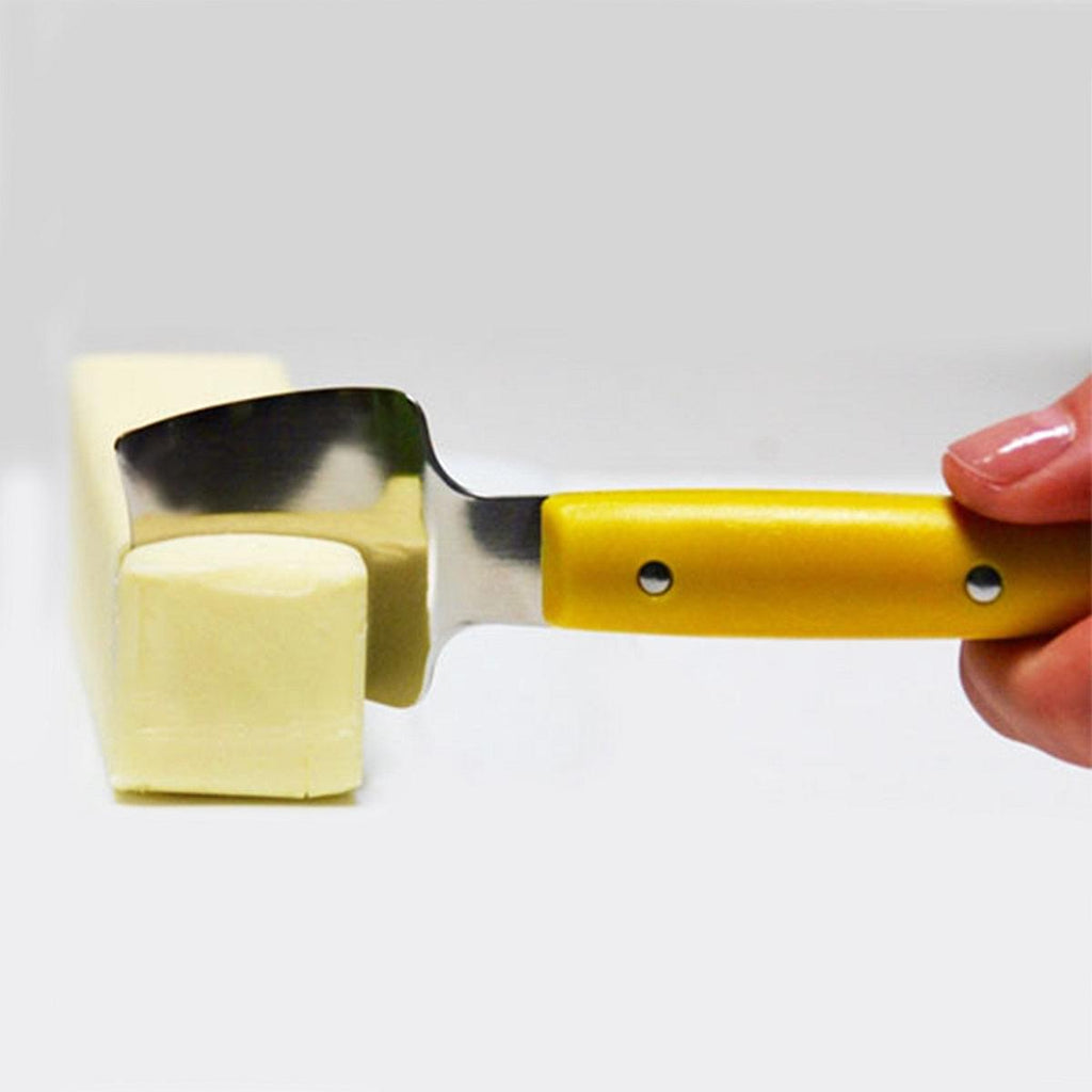 A Foodie using a Corn Holder 5pc Set plus Butter Once 2pk (BUNDLE) from Grand Fusion Housewares, LLC to cut a piece of butter.