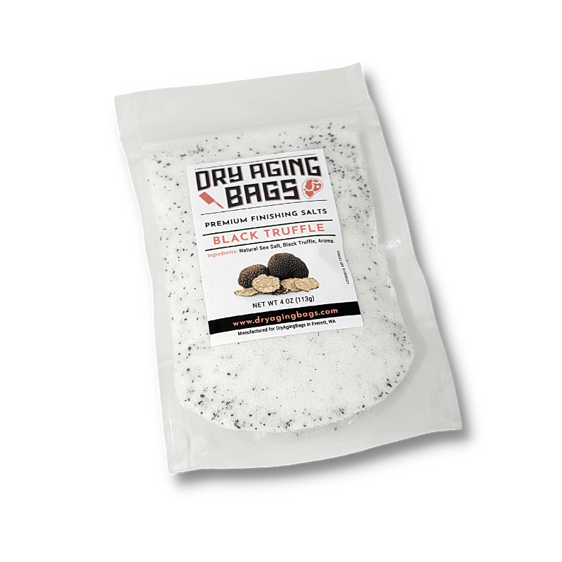 A bag with a bag of Black Truffle Salt by DryAgingBags™ and a Meat Tenderizer Tool.