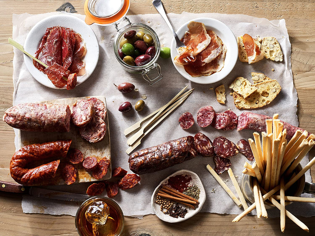 A special table spread for meat lovers and foodies, showcasing the Carnivore Club Classic Box Sampler.