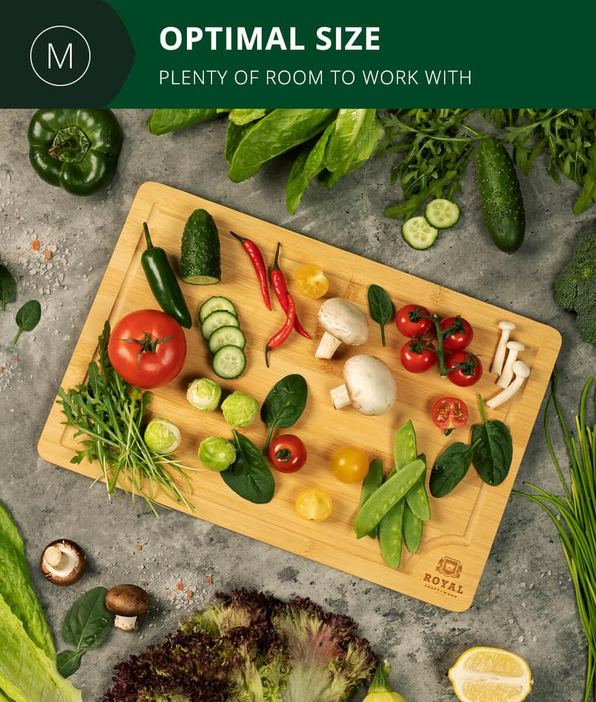A 15x10" Fruit Cutting Board with vegetables and herbs on it, perfect for Meat Lovers.