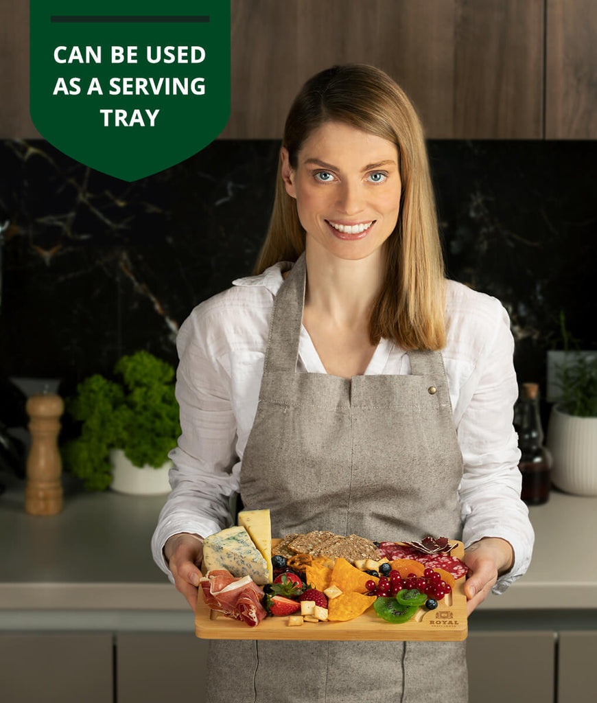 A woman holding a tray of food with the text can be used as a living tray, featuring Small Cutting Board 12×8" by Royal Craft Wood.
