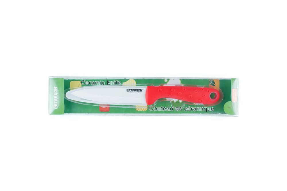A Meat Tenderizer Tool: Red soft touch handle; White Ceramic Blade ... 6" Blade by Peterson Housewares & Artwares in a package.