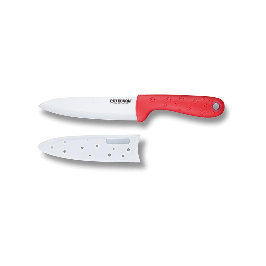 A red and white Peterson Housewares & Artwares Ceramic Knife, perfect for foodies, on a white surface.