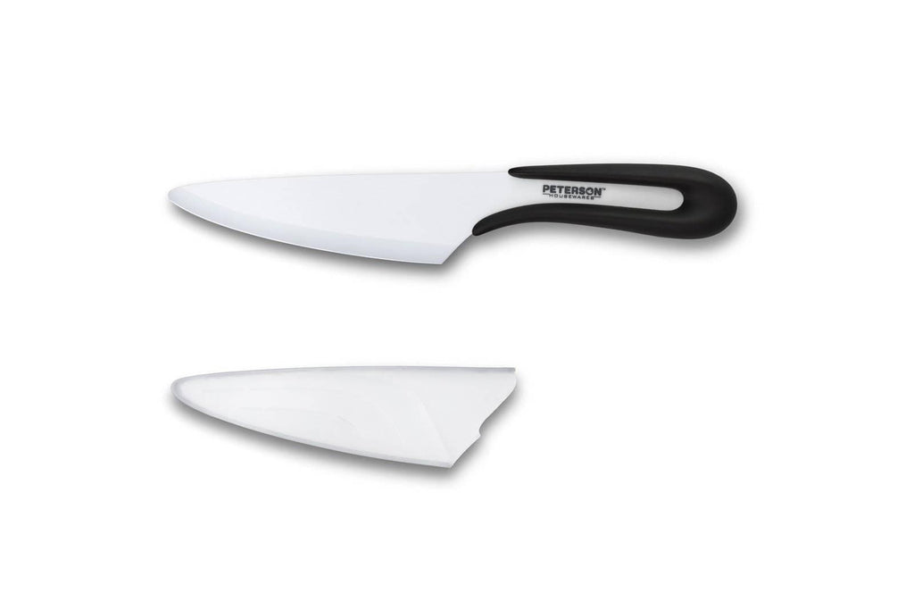A white Ceramic knife and a black Ceramic knife by Peterson Housewares & Artwares on a white surface, both available on XSpecial Marketplace.