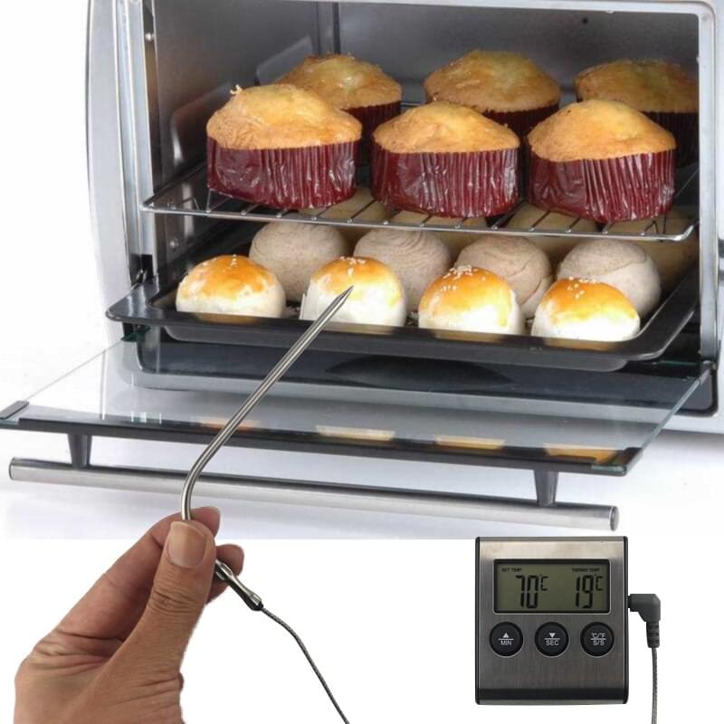 A Meat Lover is holding a Digital BBQ Thermometer by DryAgingBags™ with cupcakes in it from XSpecial Marketplace.
