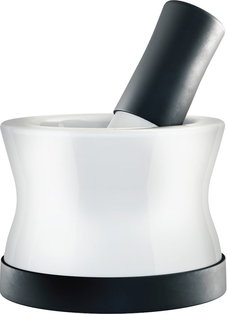 A Cooler Kitchen's white and black Mortar and Pestle Set - Small EZ-Grip Silicone & Porcelain Mortar perfect for foodies, with a non-slip silicone base, is dishwasher safe