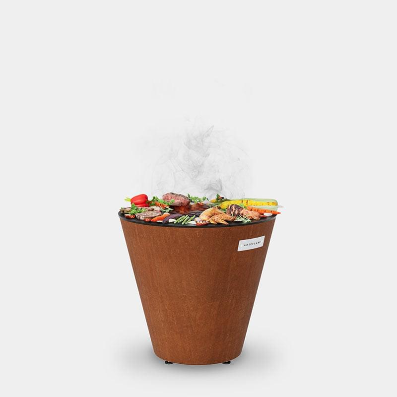 An Arteflame One Series 20" Grill filled with delicious food to satisfy XSpecial foodies.