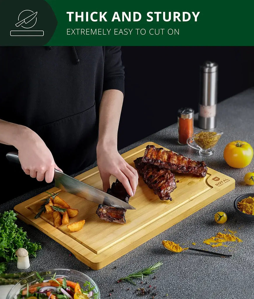 A woman is preparing food using a Royal Craft Wood bamboo cutting board 12x18 and the XSpecial Blade Meat Tenderizer Tool.