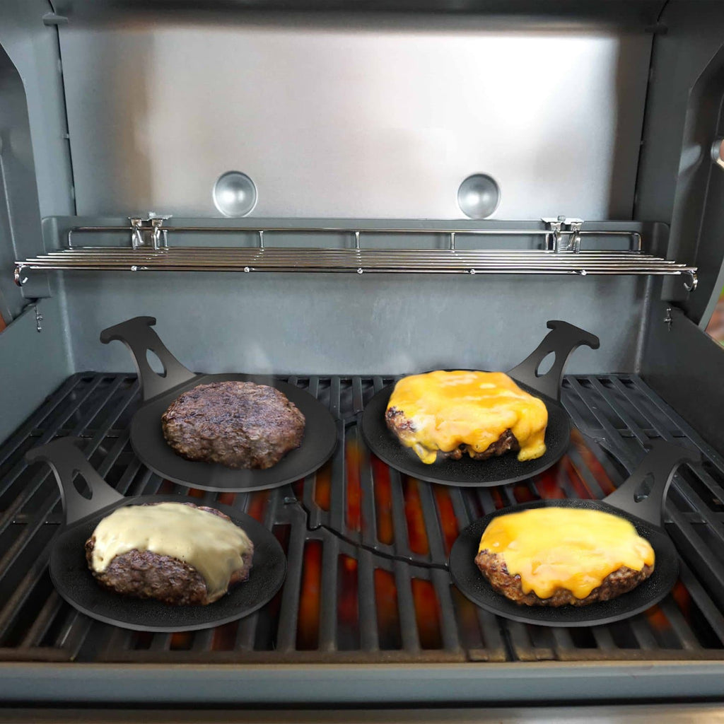 Four Mini Plancha Griddles with cheese on them for Foodies and Meat Lovers by Arteflame Outdoor Grills.