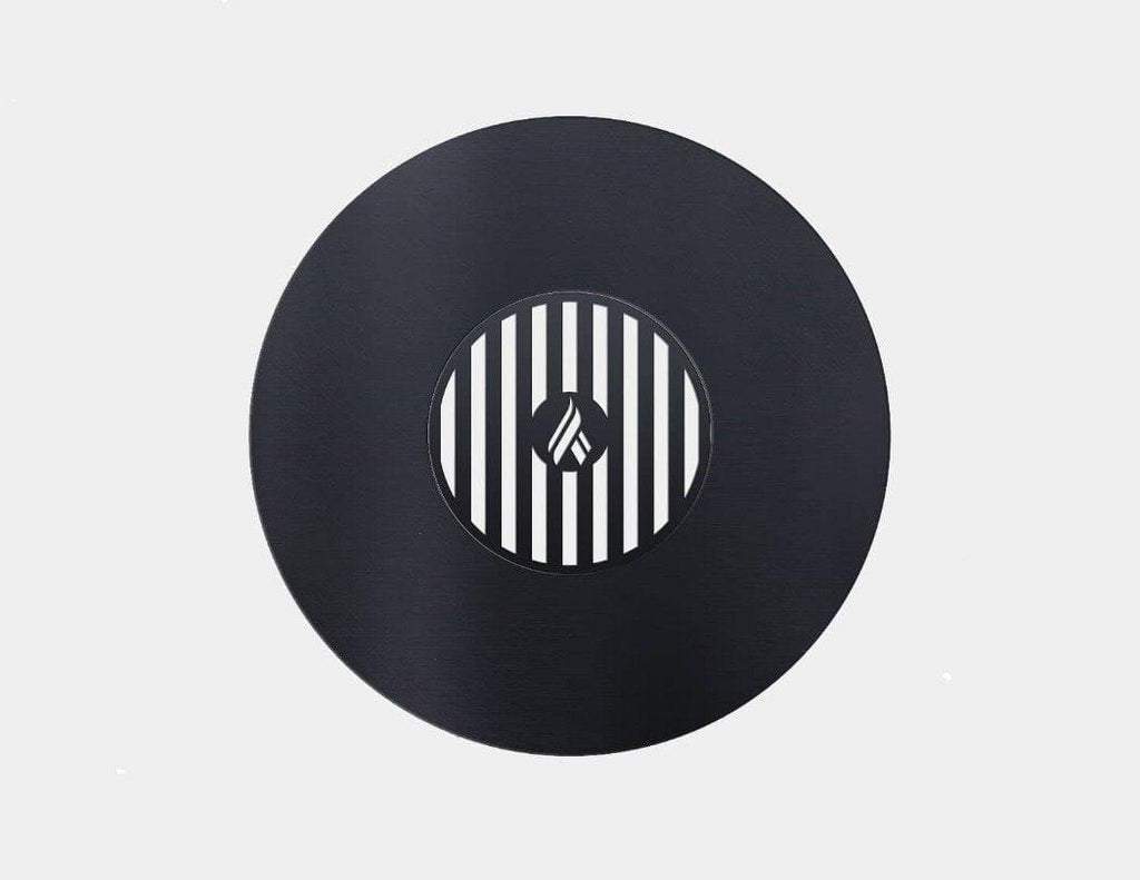 A black Green Egg Style / Kamado Style Plancha Griddle with Grill Grate Combination Insert with a striped design on it by Arteflame Outdoor Grills, perfect for foodies