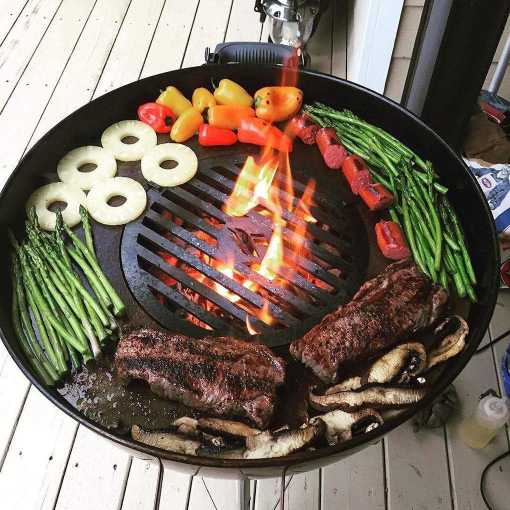 An XSpecial Arteflame Outdoor Grills Weber Style Plancha Griddle with Grill Grate Combination Insert for Meat Lovers and Foodies featuring steaks and vegetables.