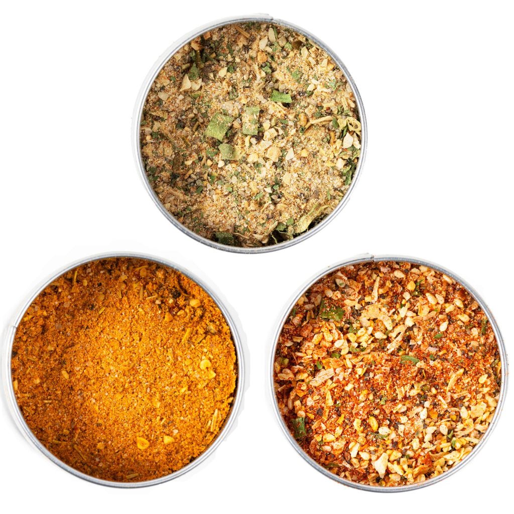 Three different types of Bougie BBQ Essentials Collection (3 Pack) spices in a bowl on a white background, perfect for Foodies.