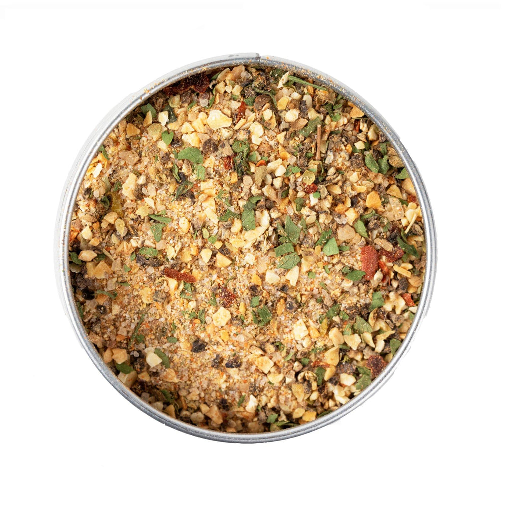 A tin with Brazilian Steakhouse BBQ Blend by Gustus Vitae, a gourmet spice blend mixture of sustainably sourced ingredients in it.