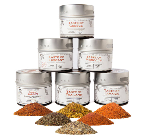 Five tins of Cuisines of the World Gourmet Seasonings Collection - 6 Pack by Gustus Vitae on a white background.