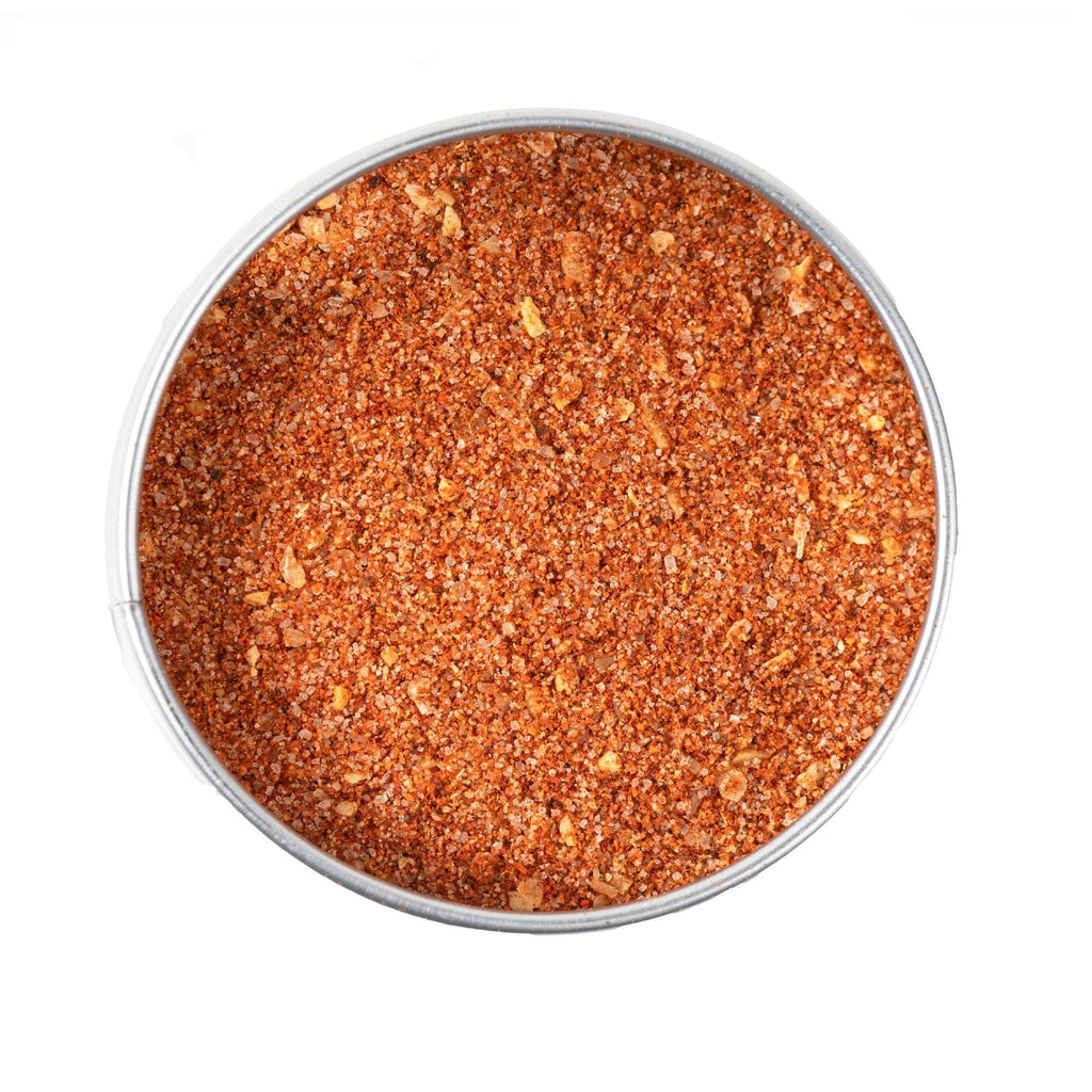 A bowl of Extra Spicy Bayou Boil BBQ Seasoning by Gustus Vitae on a white background.