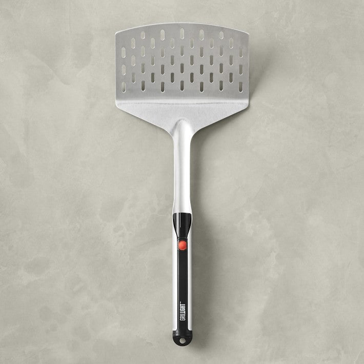 A XSpecial LED Spatula on a concrete surface.