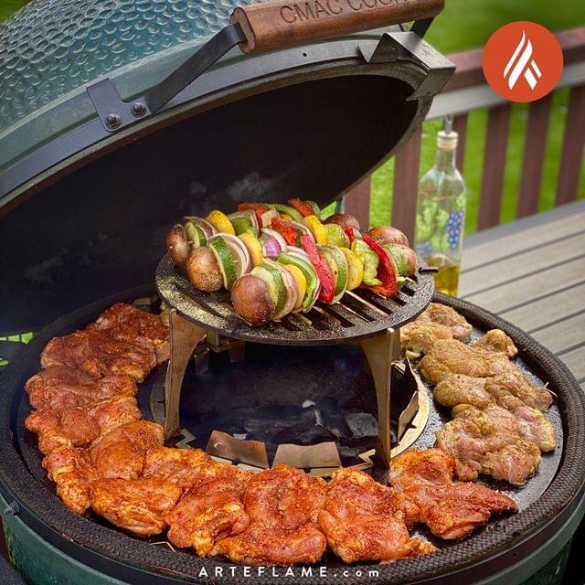 An Arteflame Outdoor Grills Green Egg Style / Kamado Style Plancha Griddle With Grill Grate Combination Insert delighted with a lot of food.